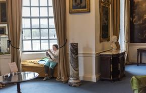 Children enjoy drawing inside the house at Plas Newydd, Anglesey